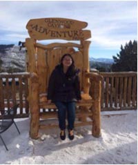 Jilin He poses on a snowy overlook.