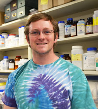 Matt Donovan works in the lab on one of the benches.